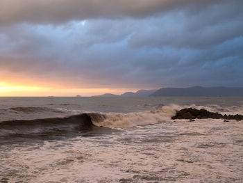 Scenic view of sea against dramatic sky