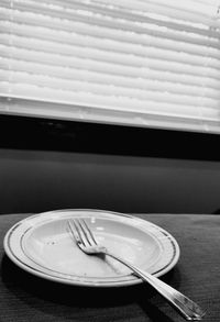 Close-up of empty plate on table