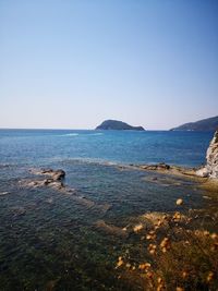 Scenic view of sea against clear sky