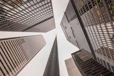 Low angle view of tall buildings against sky