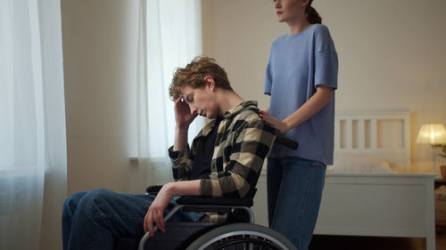 Young woman sitting at home