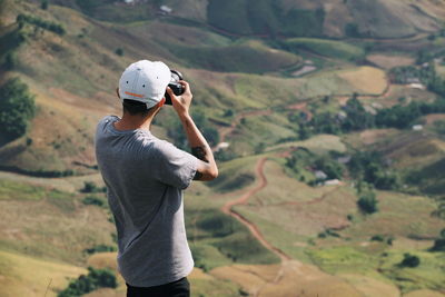 Full length of man standing on landscape