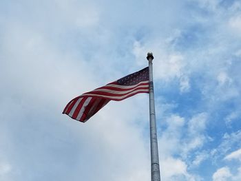 Low angle view of flag against sky