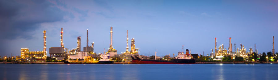 View of factory against blue sky