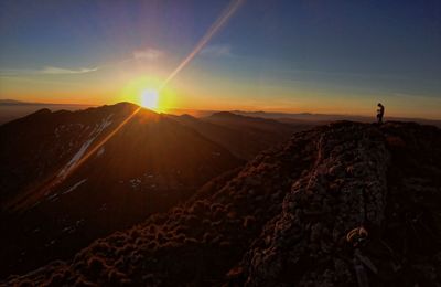 Scenic view of mountains against sky during sunset