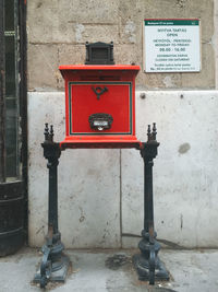 Telephone booth against wall