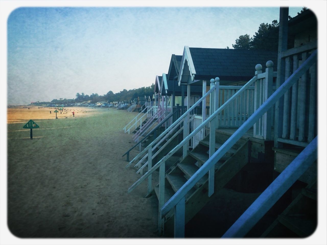 transfer print, beach, built structure, architecture, water, sea, auto post production filter, building exterior, sand, large group of people, sky, railing, person, day, incidental people, clear sky, shore, vacations, men