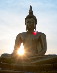 Low angle view of statue against sky