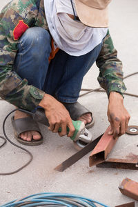 Low section of man working at construction site