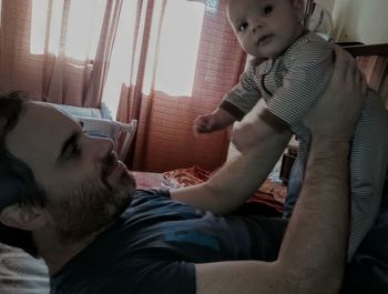 Portrait of young woman sitting on floor