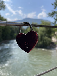 Close-up of padlocks on heart shape