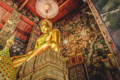 Low angle view of buddha statue in building