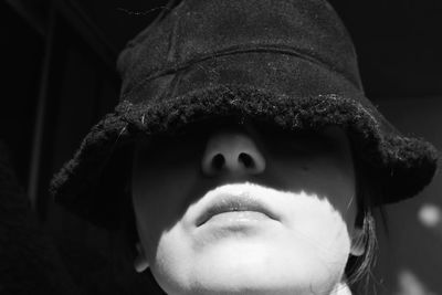 Close-up portrait of boy wearing hat