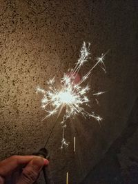 Low angle view of firework display at night