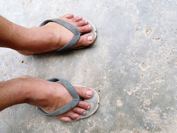 Low section of man wearing sleepers outdoors