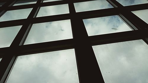 Low angle view of building against cloudy sky