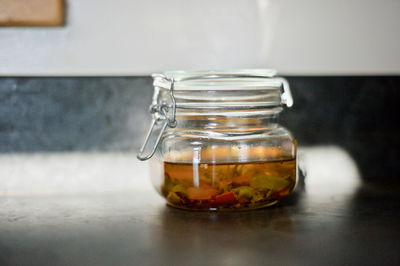 Close-up of water in jar on table