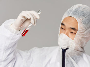 Doctor holding tube at laboratory