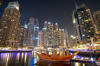 Illuminated buildings in city at night