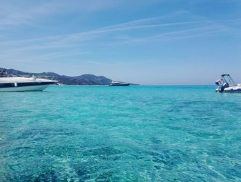 Scenic view of sea against blue sky