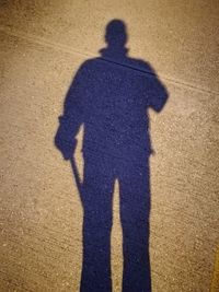 Shadow of man and woman standing in park