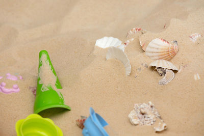 High angle view of toys on sand