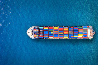 High angle view of multi colored container ship on sea