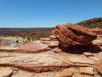 Rock formations on landscape against clear sky