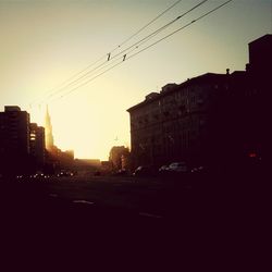 Buildings in city at sunset