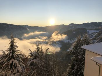 Scenic view of mountains against sky during sunset