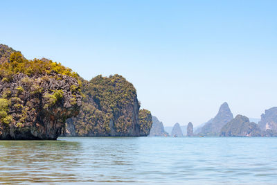 Scenic view of sea against clear blue sky