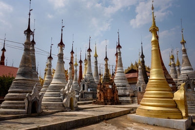 Panoramic view of temple and building against sky
