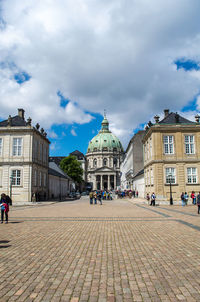 People walking on street in city