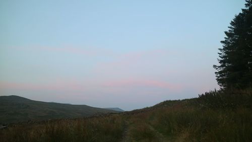 Scenic view of landscape against sky during sunset