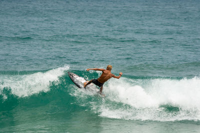 Man surfing in sea