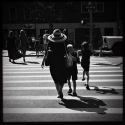 Woman standing on city street