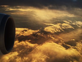 Aerial view of clouds in sky at sunset