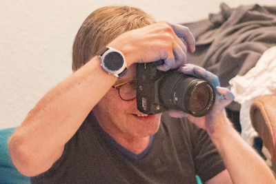 Portrait of man photographing outdoors