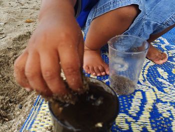 Low section of person holding drink