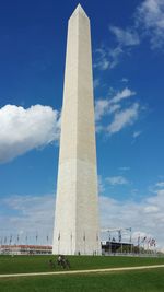 Low angle view of tower against cloudy sky