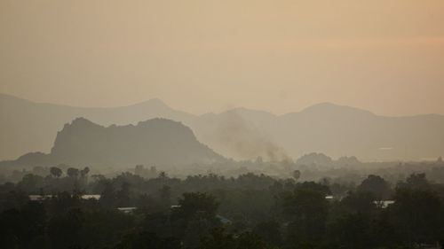 Scenic view of mountains against sky during sunset