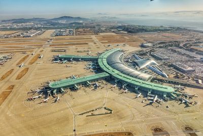 Aerial view of airplanes at airport runway