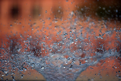 Full frame shot of wet glass window during rainy season