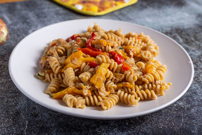 Pasta with peproni, tuna and onion. typical dish of the mediterranean diet