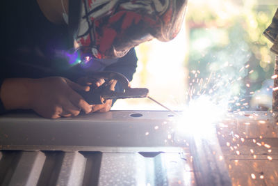 Welder, welding automotive part in a car factory