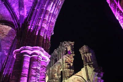 Low angle view of illuminated cathedral at night