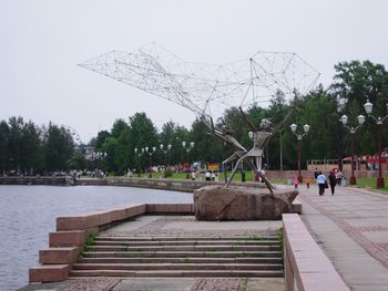 People walking on sidewalk in park