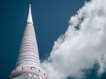 Low angle view of building against cloudy sky