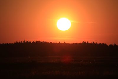 Scenic view of landscape at sunset