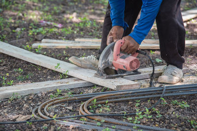 Low section of man working at construction site